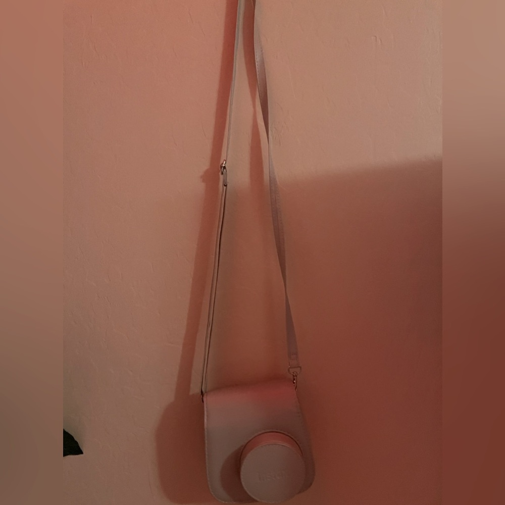 a polaroid camer case with strap.